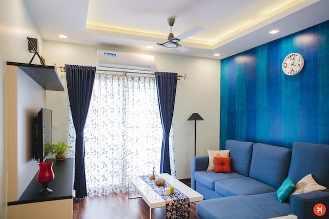 a living room with blue accents