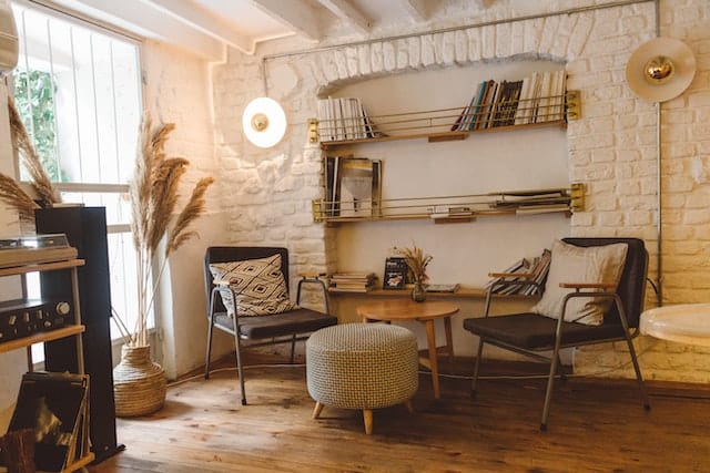 sitting area with a white brick wall and beige accents