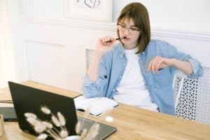 pensive person in front of laptop