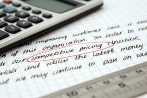 paper with "competitive pricing" circled