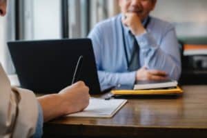 two people talking across a table