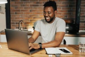 person typing on laptop